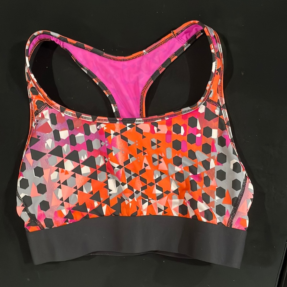 Brightly colored geometrical racer back sports bra